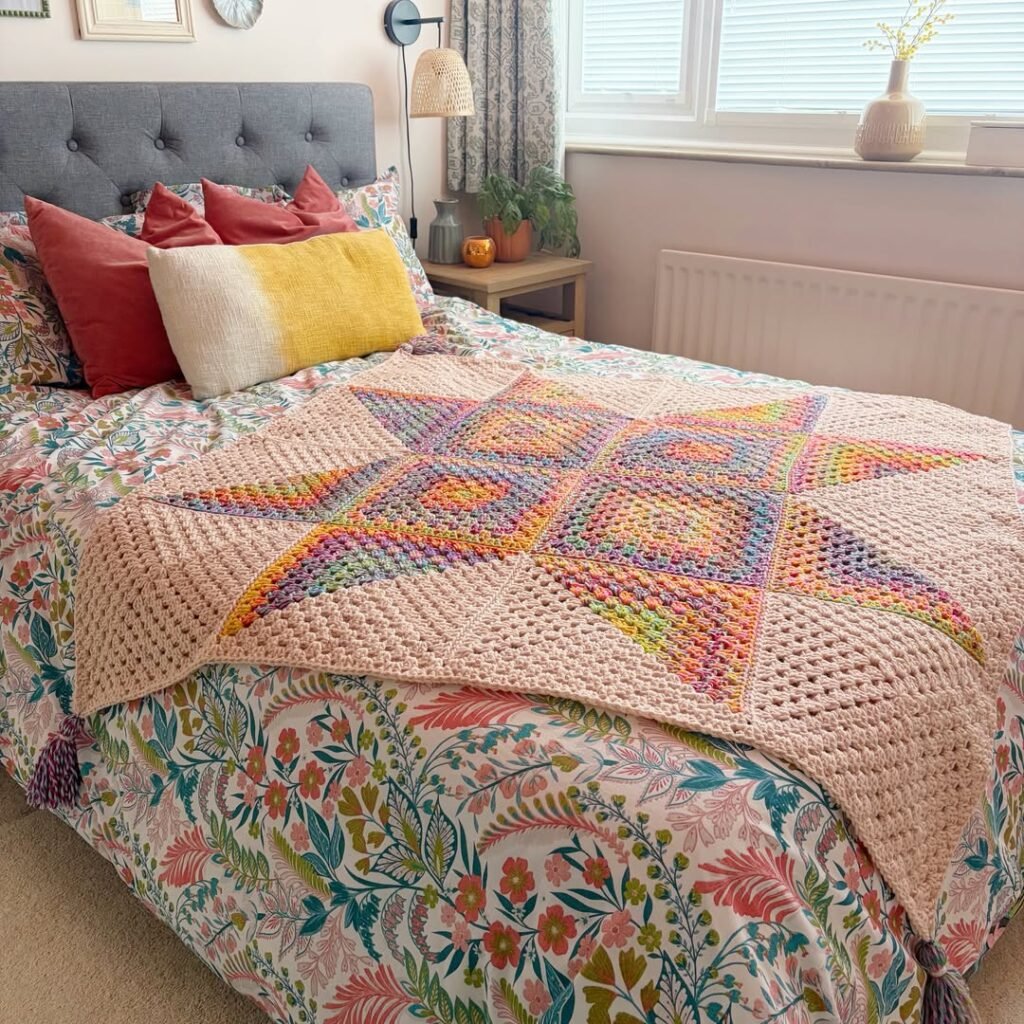 Chunky knit throw blanket on cozy styled bed