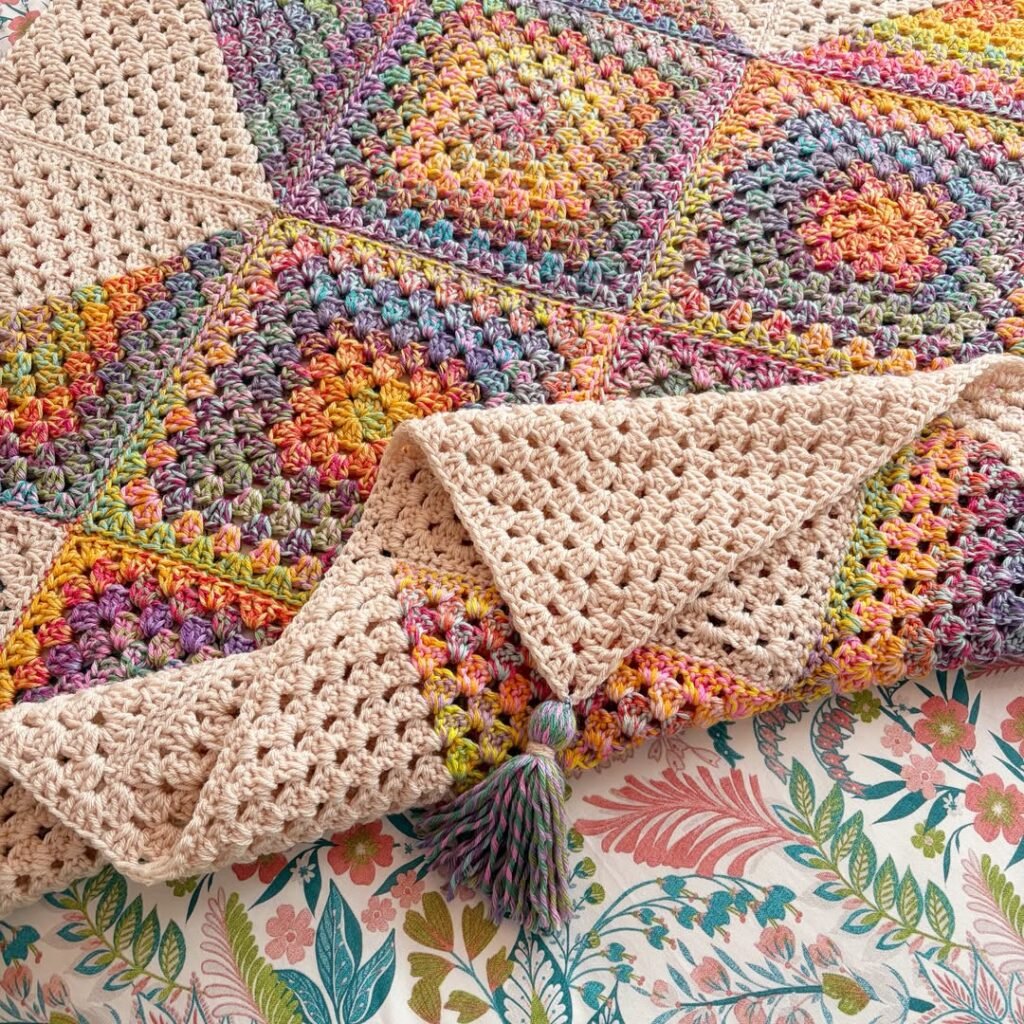 Chunky knit throw blanket on cozy styled bed