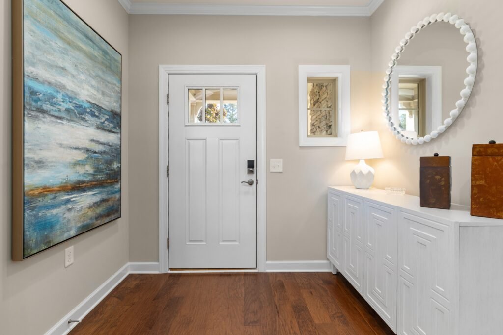 Entryway Decor Ideas: 15 Stunning Ways to Impress Guests Gallery wall in entryway with framed artwork and photos