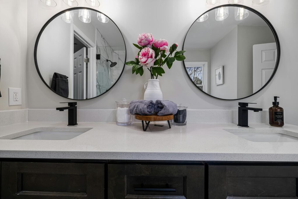 10 Bathroom Remodel Ideas on a Budget That Look Expensive Large modern bathroom mirror reflecting light in small bathroom space