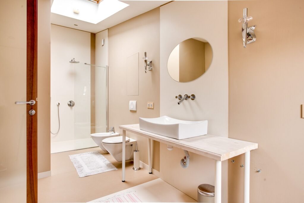10 Bathroom Remodel Ideas on a Budget That Look Expensive Organized bathroom storage shelves with towels and clean layout