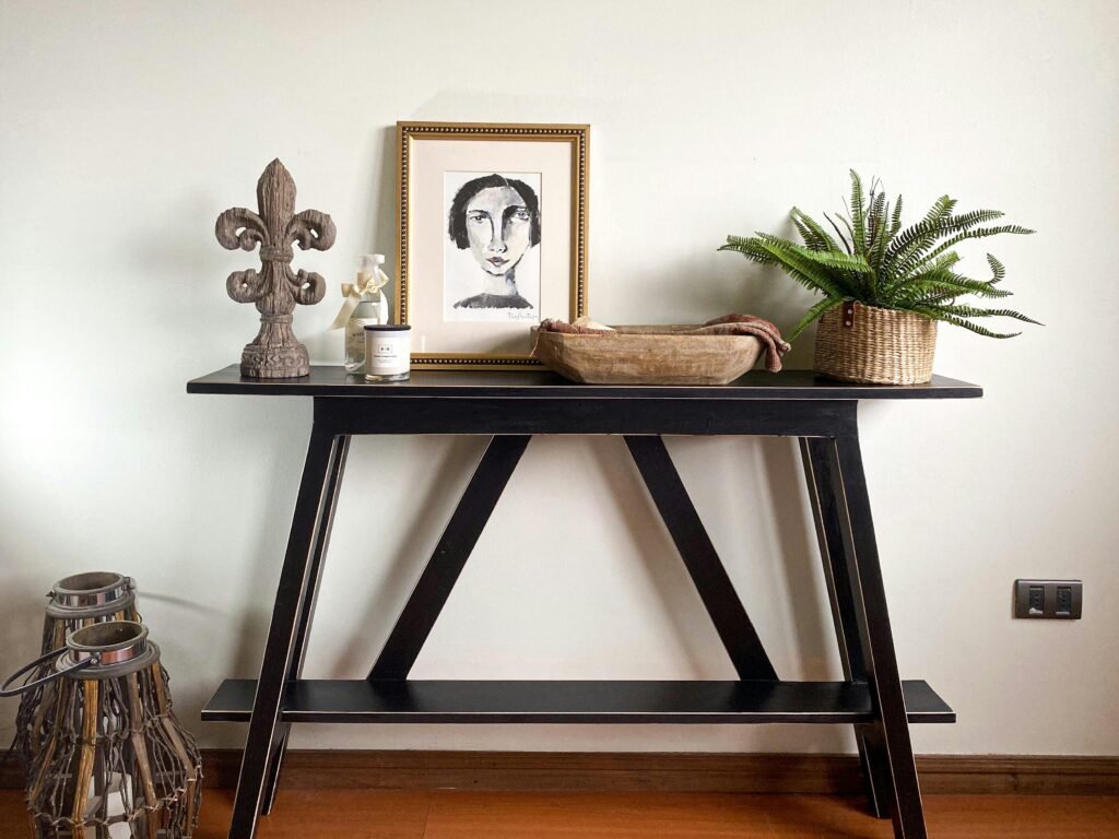 Entryway Decor Ideas: 15 Stunning Ways to Impress Guests Decorated console table with plants, books, and decorative tray